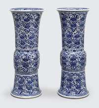 ENCIRCLED LEAF MARKS, KANGXI (1662-1722) A PAIR OF LARGE BLUE AND WHITE GU-SHAPED BEAKER VASES
